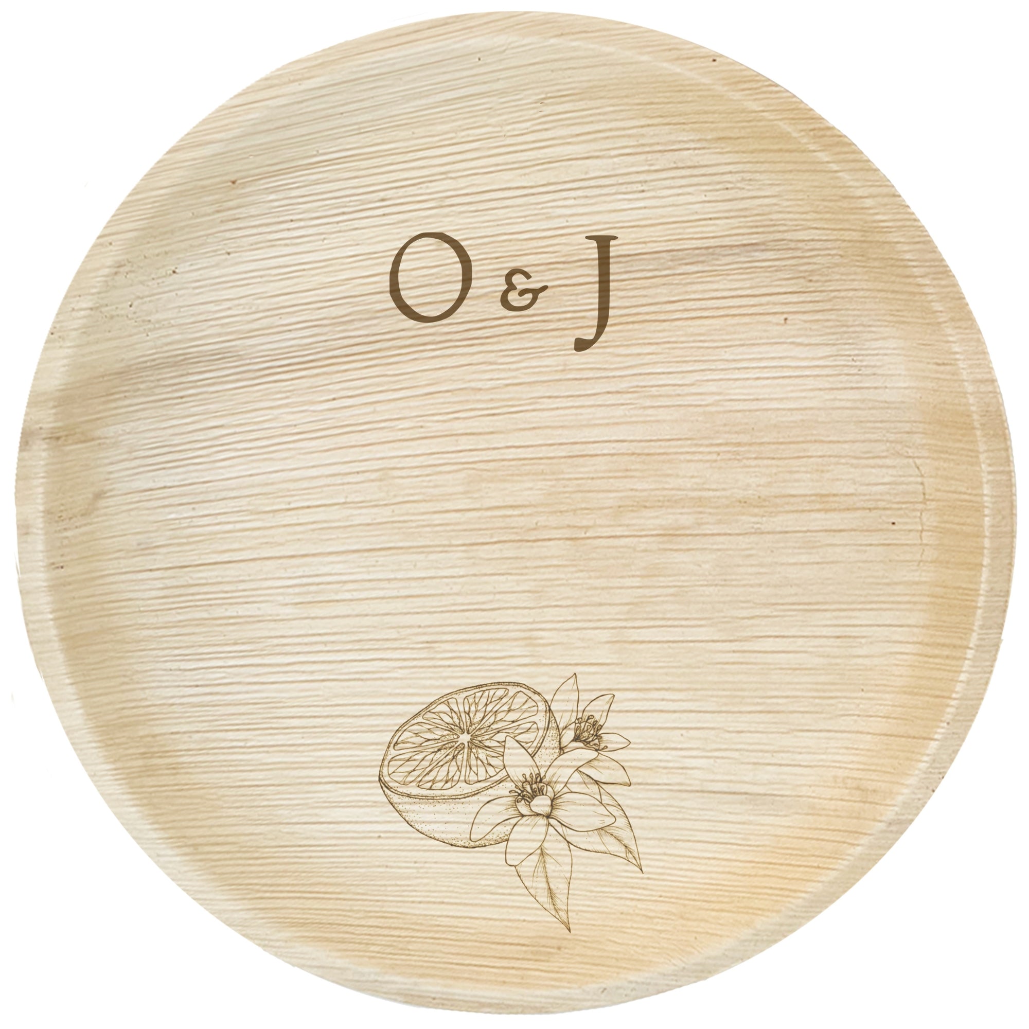 maaterra compostable palm leaf plate with custom orange blossom engraving over white background.