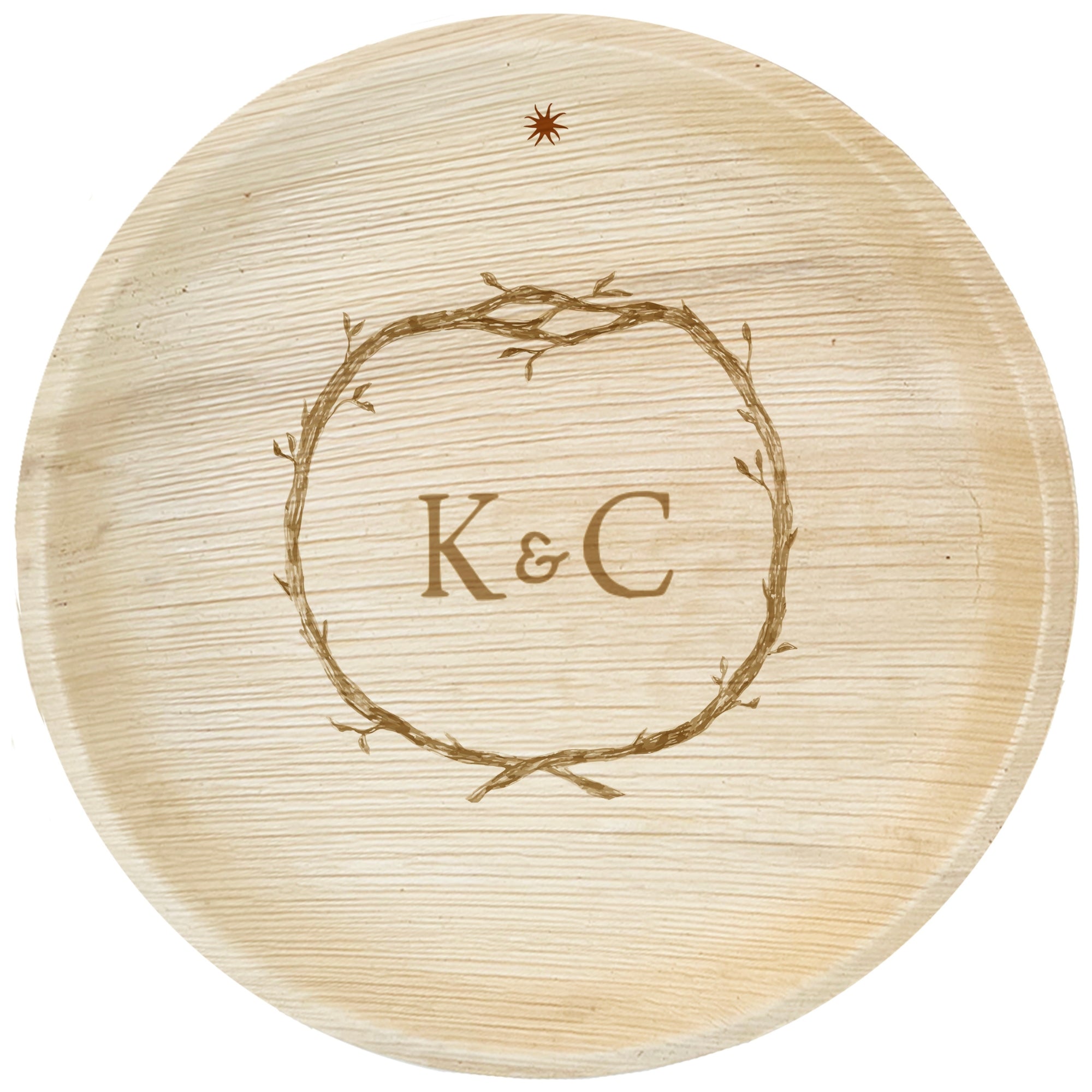 maaterra compostable palm leaf plate with custom wreath engraving on a white background. 