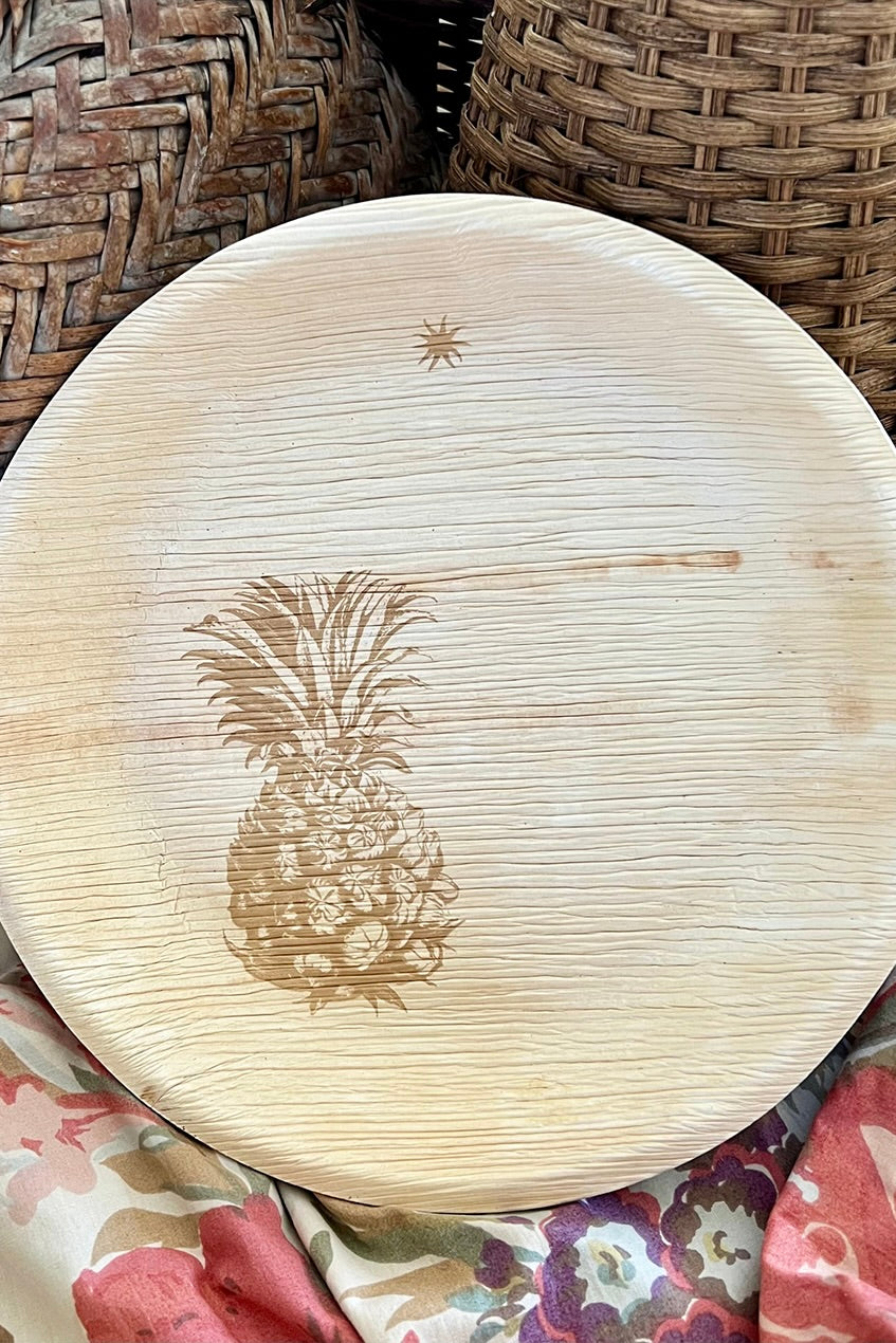 Compostable plate with fresh pineapple design.