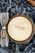 maaterra compostable palm leaf plate with high five design on tablecloth. 