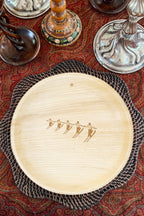 maaterra compostable palm leaf plate with high five design on a winter table setting.