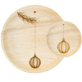 White background. maaterra compostable palm leaf plate with holiday Ornament design.