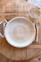 maaterra compostable plate with rustic wreath design. 