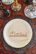 maaterra compostable palm leaf plate with silhouette design and winter table setting. 