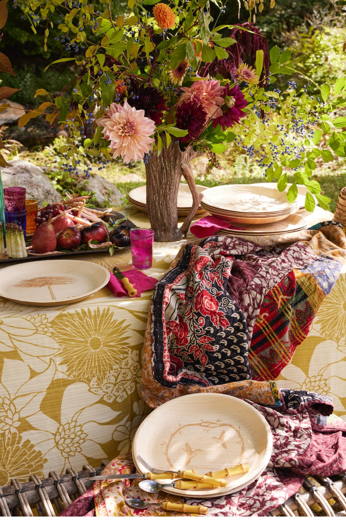 Decorative table setting with floral arrangements and maaterra compostable palm leaf plates. 
