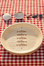 maaterra compostable palm leaf plate with stacked fish design.
