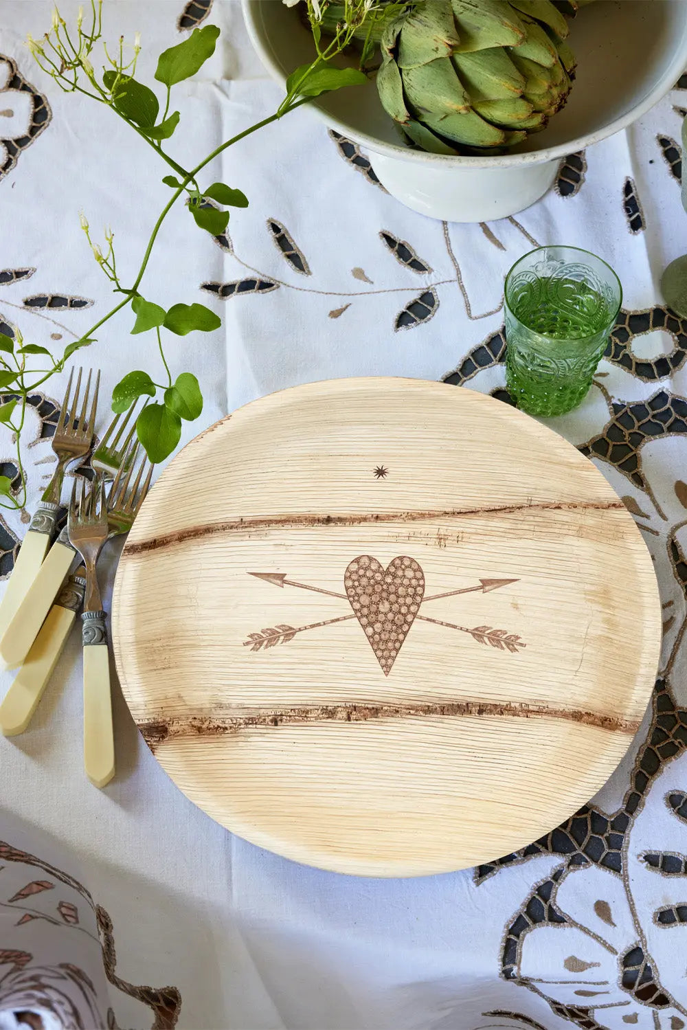 maaterra compostable palm leaf plate with stone heart design.