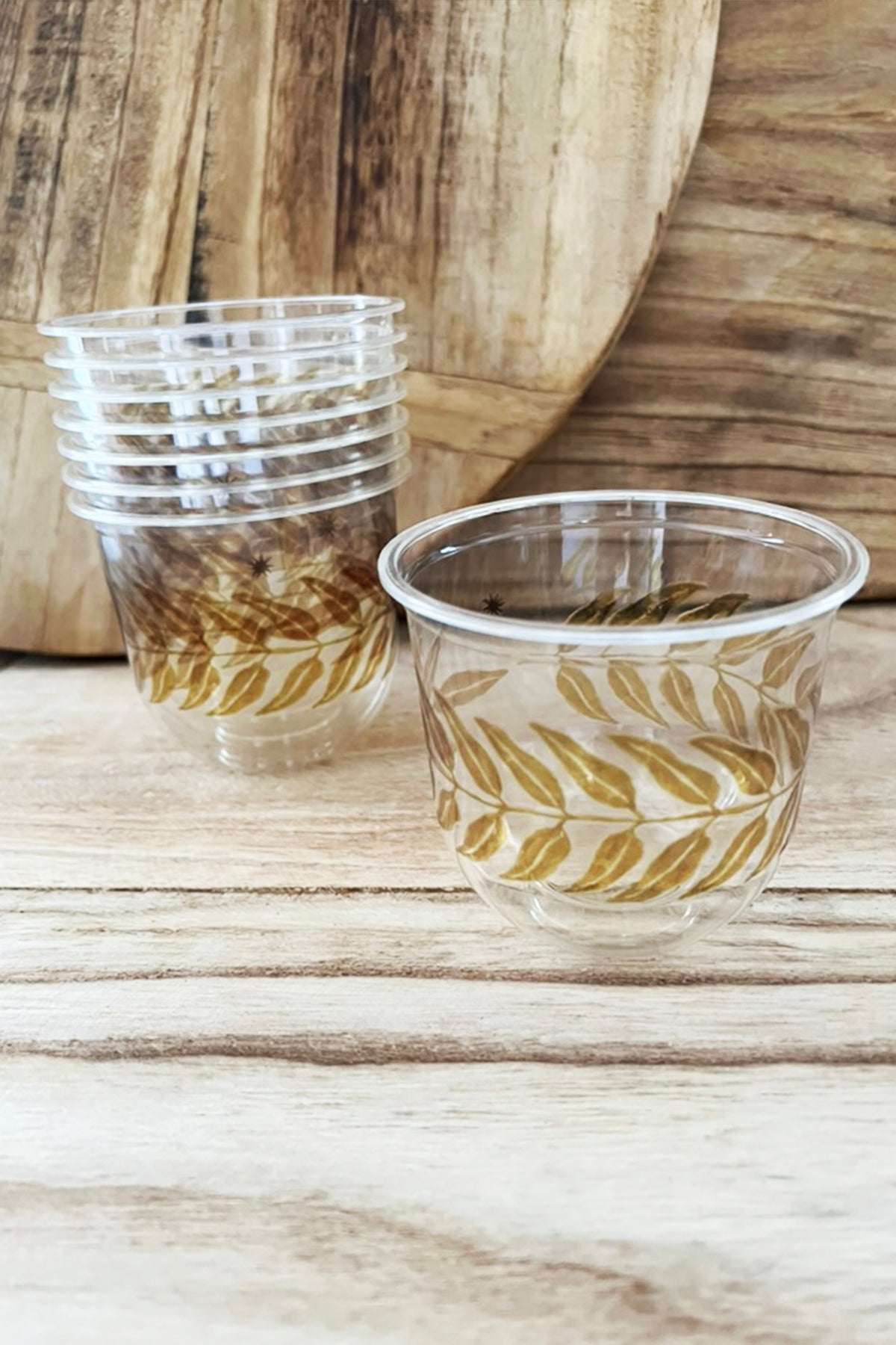 maaterra compostable clear cups with honey leaves design.
