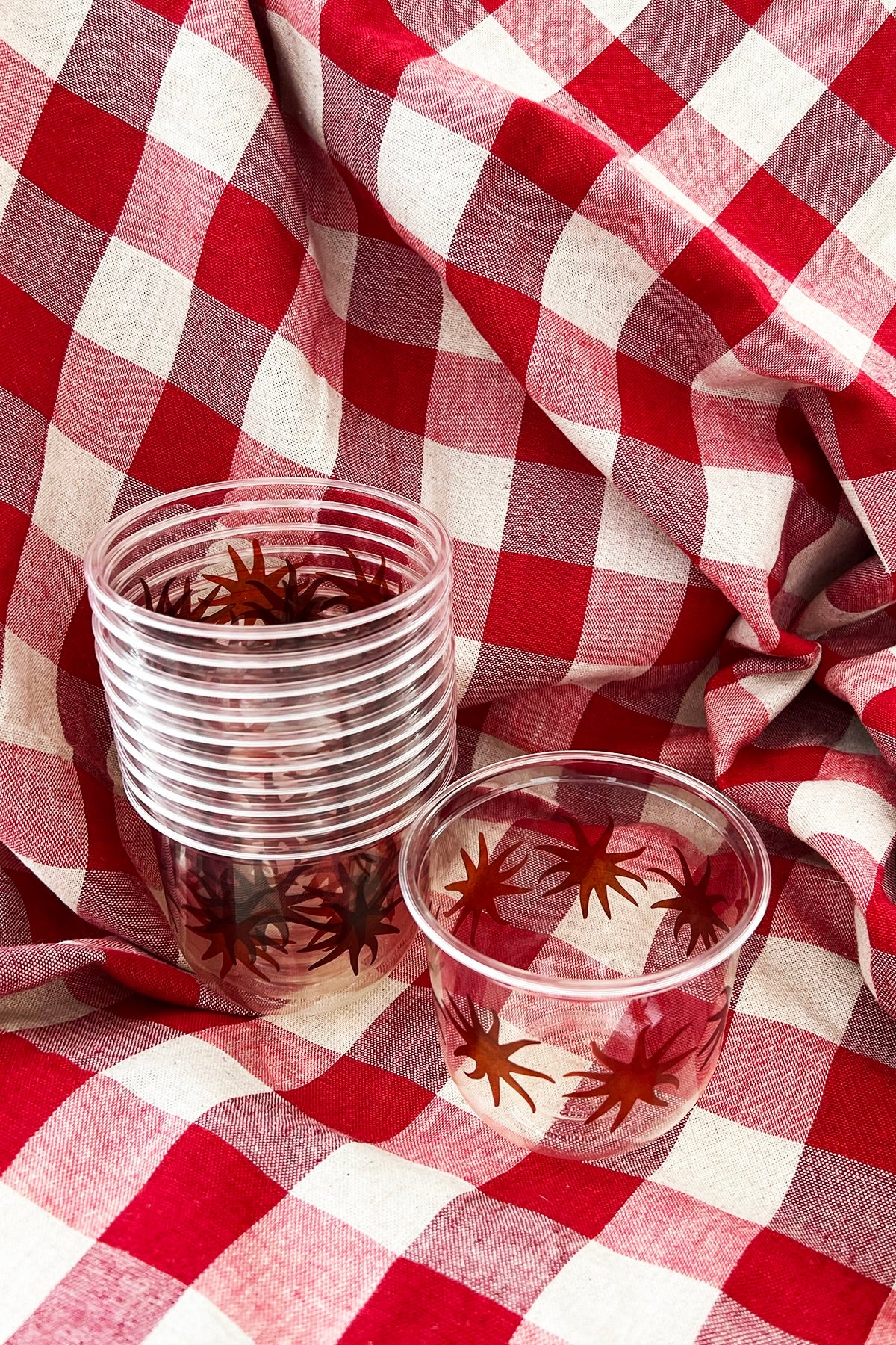 maaterra clear compostable cups with sun design.