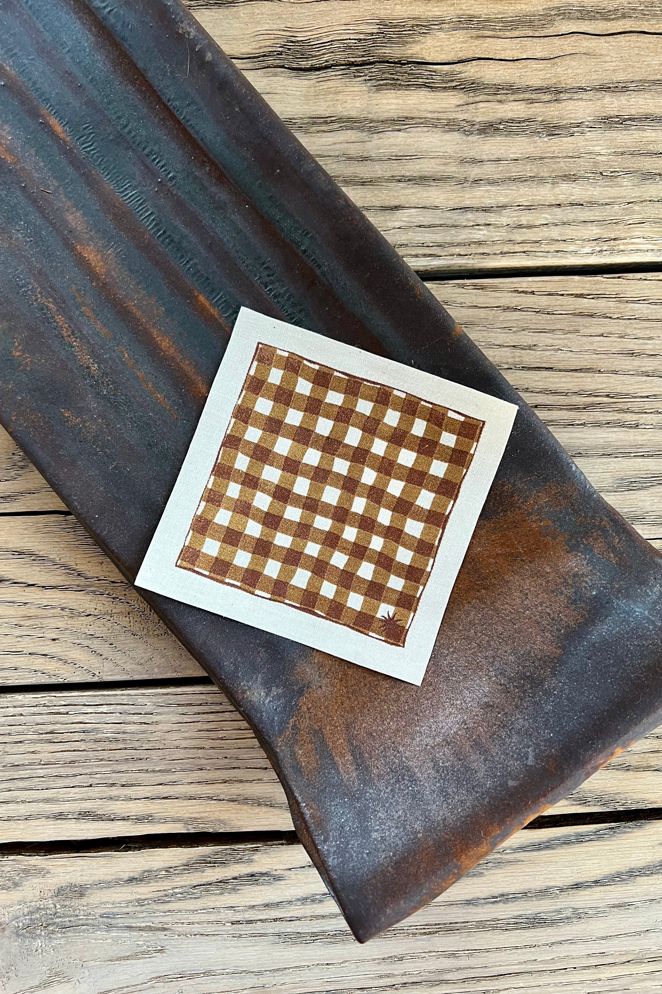 maaterra sustainable cocktail napkin with gingham design. 