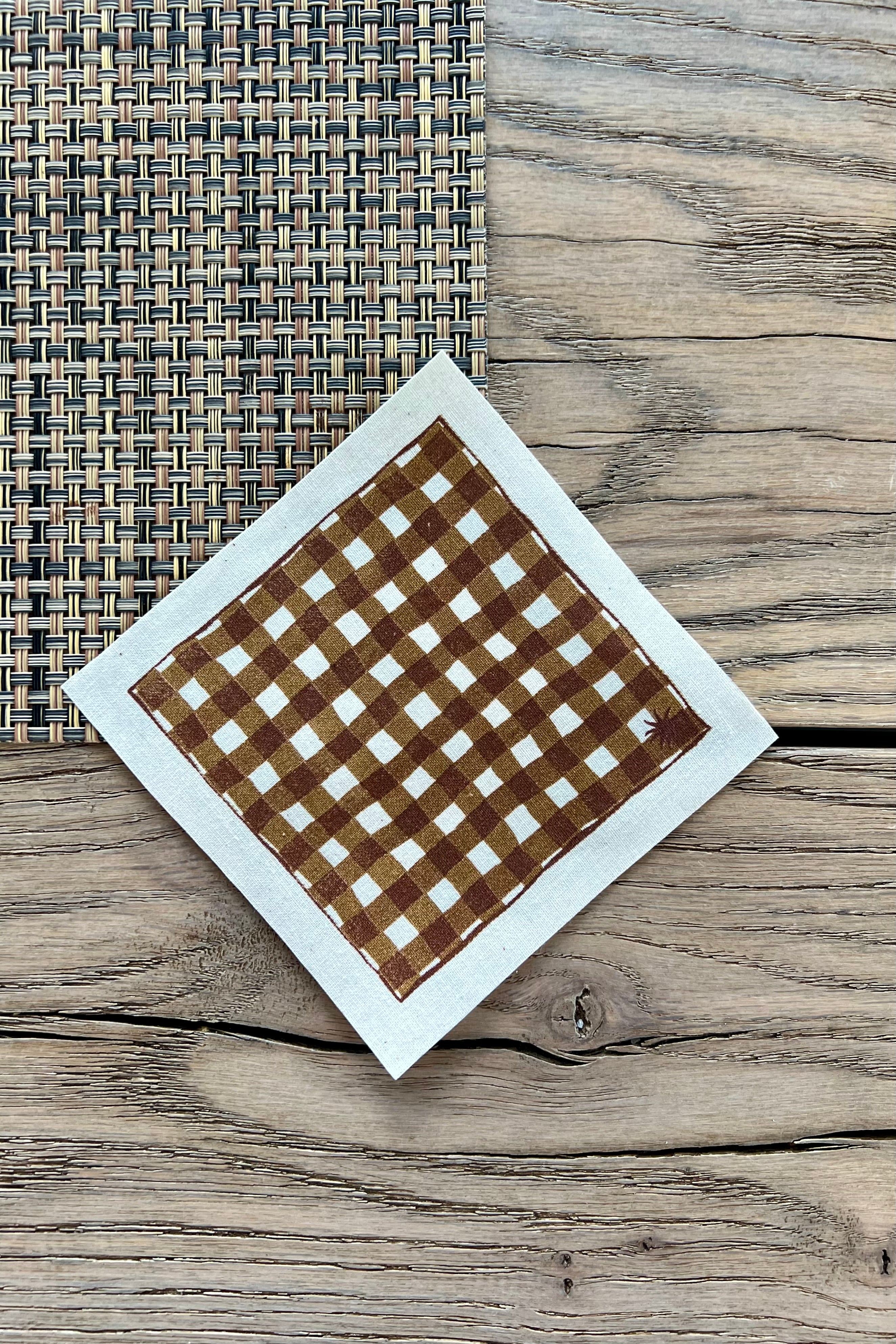 maaterra sustainable cocktail napkin with gingham design. 