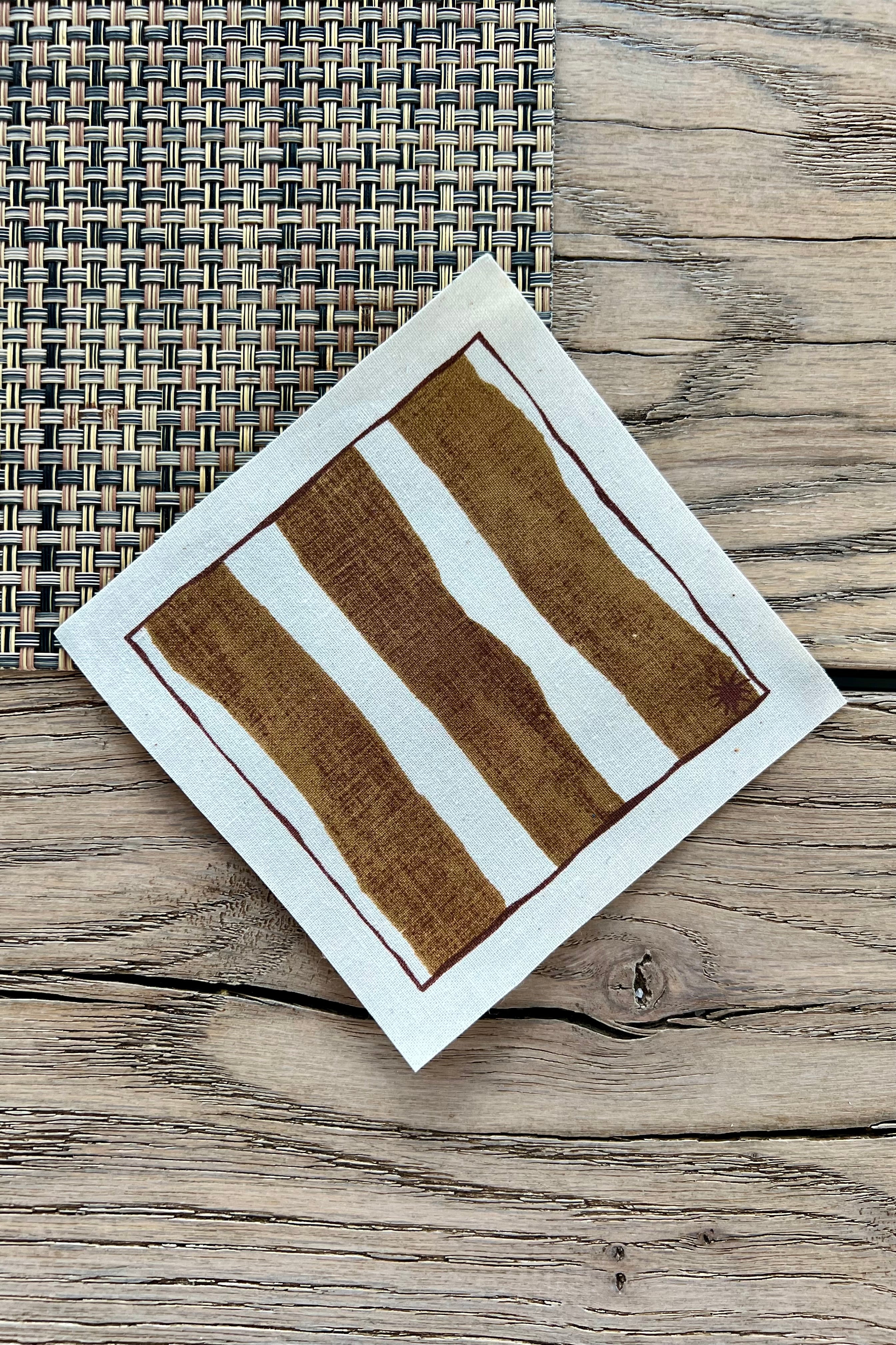 maaterra sustainable cocktail napkin with wide stripe design.